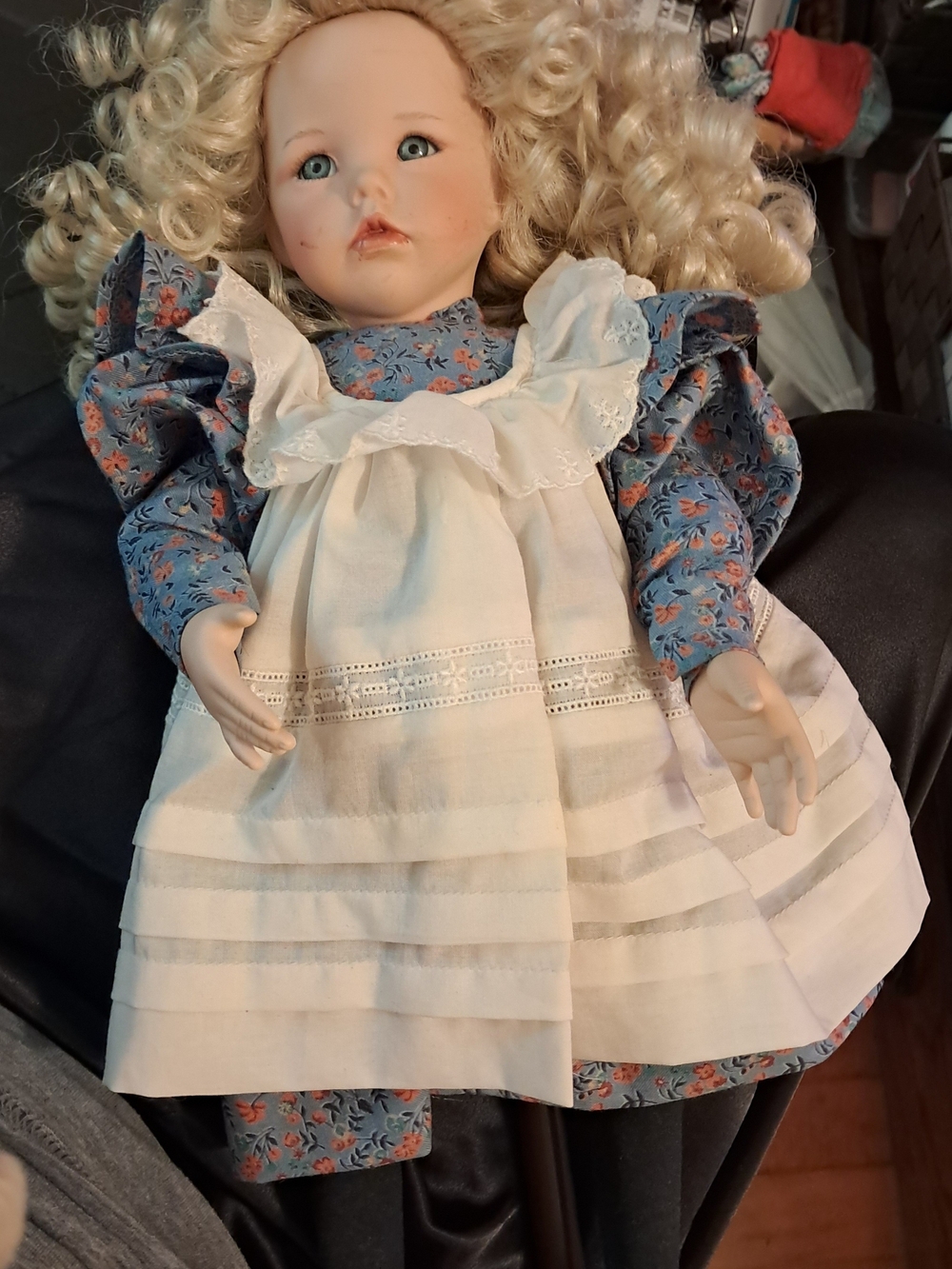 Porcelain Collectible Doll in Blue Floral Dress with White Apron